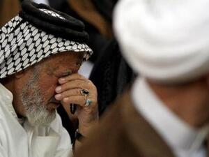 Sunni and Shiite Muslims perform a joint Friday prayer at a mosque in Baghdad on May 31, 2013.  (AFP/File)
