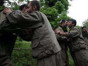 Kurdistan Workers' Party (PKK) fighters greet their comrades as they arrive in the northern Iraqi city of Dohuk on May 14, 2013, after leaving Turkey as part of a peace drive with Ankara. (Safin Hamed/AFP)