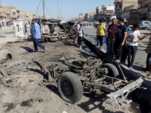 Iraqis inspect the site of a car bomb explosion in the impoverished district of Sadr City in Baghdad on July 29, 2013. (AHMAD AL-RUBAYE/AFP/Getty Images)
