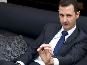 A handout picture released by the Syrian Arab News Agency (SANA) on June 17, 2013, shows Syrian President Bashar al-Assad speaking during an interview (AFP)