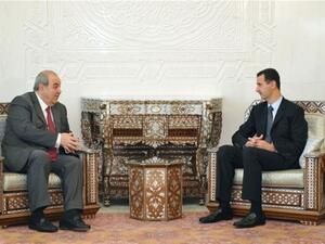 الرئيس السوري مستقبلا اياد علاوي-ا.ف.ب