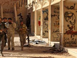 كنيسة عراقية مكتوب على جدرانها عبارات خطها عناصر تنظيم الدولة الاسلامية "داعش"