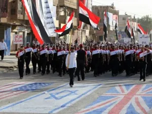 على وقع هتافي "كلا كلا امريكا" و"كلا كلا اسرائيل" سار الآلاف من مؤيدي الزعيم الشيعي الشاب وسط مدينة الصدر