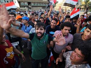 Iraqi protesters shout slogans during a demonstration against corruption in Baghdad's Tahrir Square on Sept. 4, 2015. (AFP/Haidar Mohammed Ali)
