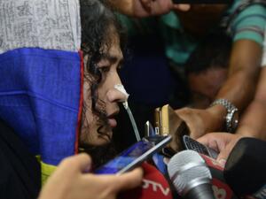 Indian rights activist Irom Sharmila talks to media after appearing before a District and Sessions Judge at Imphal West court in Imphal on August 9, 2016. (AFP/Biju Boro)