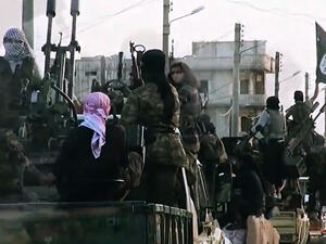 A screen shot of a Daesh propaganda video shot last March shows militants riding on tanks through the northern Syrian city of Homs, experts say the use of children in the most recent videos reflects a drastic change in direction. (AFP/File)