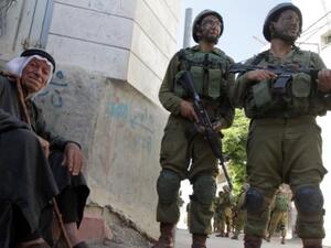 Israeli troops conduct a search operation in Tapuah, a Palestinian village near the southern West Bank city of Hebron, June 2014.  (AFP/Hazem Bader)