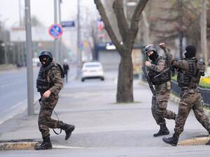 Istanbul police walk down a street in full gear. (AFP/File) Istanbul police walk down a street in full gear. (AFP/File)