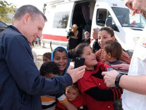 Hardy plays with Palestinian children during a January trip to the West Bank. (MAP)