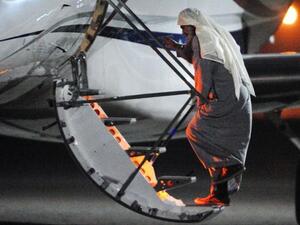 Radical Islamist cleric Abu Qatada boarding a privately chartered jet at the RAF Northolt base in west London, early on July 7, 2013, as he gets deported to Jordan.(AFP / MOD Crown Copyright)