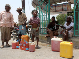 Yemenis sell petrol on the street after Yememi government forces re-entered Zinjibar the capital of the southern Abyan province on August 16, 2016 following an offensive backed by Saudi-led air strikes to recapture the city from Al-Qaeda jihadists. (Photo credit: AFP)