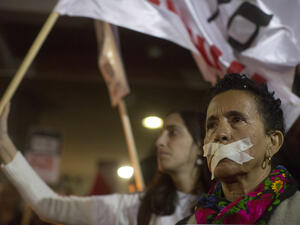 A protest in solidarity with human rights and anti-occupation organizations that had been targeted by right-wing groups and politicians in previous weeks, Tel Aviv, December 19, 2015. (Oren Ziv/Activestills)