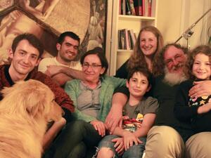 The Jellinek family in their home in Berlin, with their houseguest, Kinan, a Syrian Muslim refugee (second from left). When Chaim Jellinek told Kinan he was Jewish, Kinan said he had no problem with that. (Photo credit: Credit: Daniel Estrin).