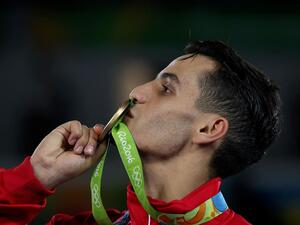 Ahmad Abughaush kisses the gold medal he won for Jordan in the 2016 Olympics in RioTaekwondo PHOTO: Salem Khamis (Photo credit: Wikimedia Commons).