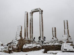 Men play after a snowstorm in January 2012 at the Amman Citidel. [wodumedia]