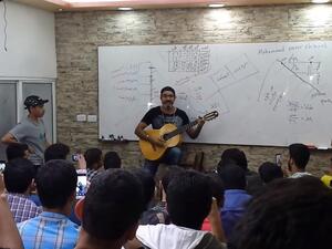 Whether he is dancing, playing Oud or guitar, Shbool is always full of energy while teaching (Youtube)
