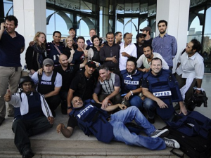 Journalists celebrate after being held hostage in Libya during the 2011 uprising. (AFP/File) Journalists celebrate after being held hostage in Libya during the 2011 uprising. (AFP/File)