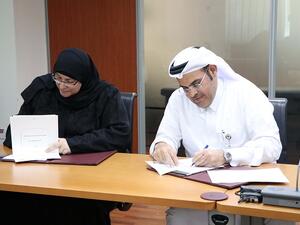Mrs. Rima Mohammed Abu Khadija, Director of Educational Supervision Department, Ministry of Education and Higher Education; and Mr. Abdulla Ahmed Al Mansoori, Director of Qatar Career Development Center (QCDC), during the recent MoU signing ceremony
