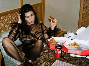 'Pizza party': Kourtney Kardashian shares racy pic on Instagram of her in a see-through lace top that shows that flashes her bra (Source: kourtneykardash - Instagram)