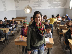 A Syrian Kurdish teacher and her students in Kobane.  (AFP/Michalis Karagiannis)