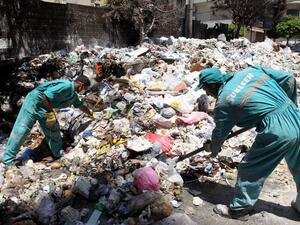 Sukleen, the company responsible for collecting Lebanon's trash, started a strike and began a crisis that evolved to a call for economic reform. (AFP/File)
