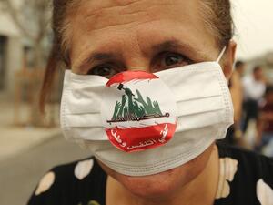 An activist attends a demonstration in Beirut against government inaction on Lebanon's growing garbage crisis, September 2015. (AFP/Anwar Amro) 