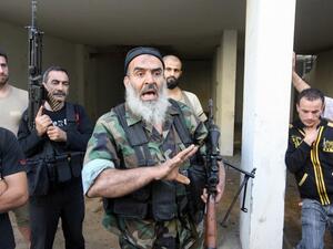 Sunni Salafist gunmen, who back the Syrian opposition, are seen in the northern Lebanese city of Tripoli on May 23 (AFP)