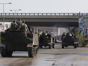 LEBANON, Beirut : Lebanese army troops patrol the airport road on the southern outskirts of Beirut on August 9, 2013, following the kidnapping by gunmen early in the morning of two pilots working for Turkish Airlines on the road leading to the airport. AFP PHOTO / ANWAR AMRO