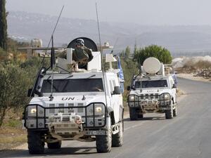 LEBANON, KFAR KILA : Peacekeepers of the United Nations Interim Force in Lebanon (UNIFIL) patrol along the Lebanese-Israeli border on August 23, 2013 in Kfar Kila after the Israeli air force launched a rocket toward a Palestinian group in Lebanon. AFP PHOTO MAHMOUD ZAYYAT
