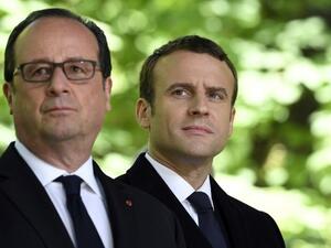 Then French President Francois Hollande (L) and French President-elect Emmanuel Macron at a special ceremony at the Jardin du Luxembourg, on May 10, 2017. (AFP/ Eric Feferberg)