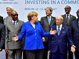 German Chancellor Angela Merkel and other leaders pose for a picture during the two-day G20-Africa partnership investment conference in Berlin on June 12, 2017. (John Macdougall/ AFP) 
