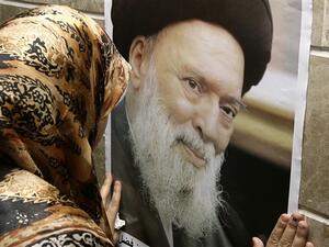 LEBANON, Beirut : A Shiite woman mourns the death of the late Grand Ayatollah Sayyed Mohammed Hussein Fadlallah (photo) at a mosque where his funeral is being held in Beirut&#039;s southern suburb on July 4, 2010, following his death earlier today at the age of 75 from internal bleeding an aide said. 