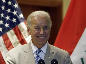 IRAQ, Baghdad : US Vice President Joe Biden smiles during his address to US troops during a naturalisation ceremony at Al-Faw Palace in Baghdad's Camp Victory on July 4, 2010. 