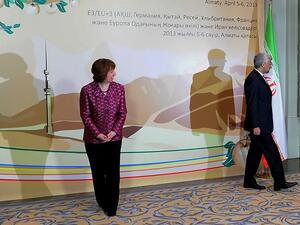 EU foreign policy chief Catherine Ashton (L) looks at Iran's top nuclear negotiator Saeed Jalili (R) leaving the podium after their meeting on the sidelines of the Iran's talks with world powers representatives on Iran's nuclear programme in the Kazakh city of Almaty. (AFP PHOTO /ILYAS OMAROV)
