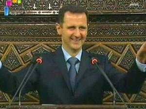 Assad during his speech. AFP