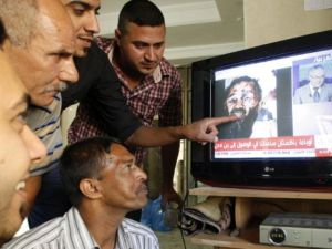 Mixed reactions: Some hail it as the death that might spawn peace, while others fear the beginning of the end.