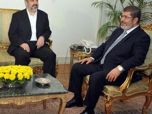 Morsi successfully negotiated an Israeli ceasefire speaking to Hamas' Khaled Mashaal (pictured) but so far has struggled more with calming the waters in his own country. 