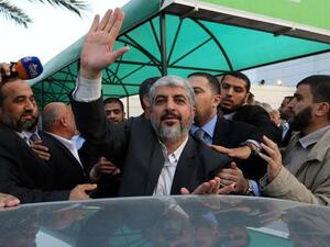 Khaled Meshaal waves as he leaves the Gaza Strip on Monday (AFP PHOTO / HO / ISMAIL HANIYA'S OFFICE)