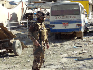 An Iraqi security officer inspects the site of an explosion on Wednesday in Kirkuk. (Marwan Ibrahim/AFP)