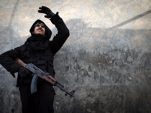 A Rebel fighter points at smoke rising in the city of Aleppo on Friday. UN leader Ban Ki-moon has warned that Syria is in a "death spiral". (AFP)