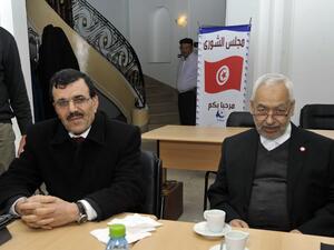 Interior Minister Ali Larayedh and Ennahda ruling party's leader Rached Ghannouchi pose before a meeting at the party's headquarters on Friday. (AFP PHOTO / FETHI BELAID)