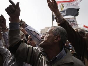 Egyptian anti-government protestors shout slogans against Egypt's President Mohamed Morsi during a demonstration in Cairo's landmark Tahrir square. (AFP PHOTO/GIANLUIGI GUERCIA)