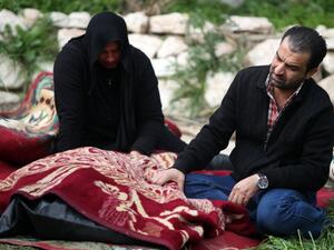 Iraqi's weep over the body of a relative killed on February 28, after the sinking of a floating restaurant belonging to the Lebanese Club in Baghdad. (AFP PHOTO/AHMAD AL-RUBAYE)