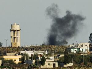 A picture taken from the Israeli side in the Golan Heights shows smoke after shells exploded in the Syrian village of al-Jamlah, close to the ceasefire line between Israel and Syria. (AFP PHOTO/JACK GUEZ)
