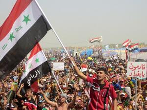 Iraqi demonstrators shout slogans during an anti-government protest in the western city of Ramadi on Friday. (AFP PHOTO/AZHAR SHALLAL)