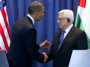 Palestinian president Mahmoud Abbas (R) and U.S. President Barack Obama shake hands following a joint press conference at the Muqata, the Palestinian Authority headquarters, in the West Bank city of Ramallah on Thursday. (AFP PHOTO/SAUL LOEB)