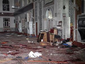 An image made available by the Syrian Arab News Agency (SANA), shows remains and the carpeted floor covered with blood inside of the Iman Mosque in the Mazraa neighborhood of the Syrian capital Damascus. (AFP PHOTO /HO-SANA) 