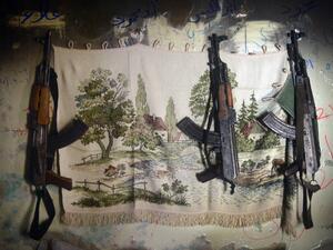 AK-47 machine guns hang in a shelter for Syrian rebels in the Salaheddine district of the northern Syrian city of Aleppo. (AFP PHOTO / DIMITAR DILKOFF)
