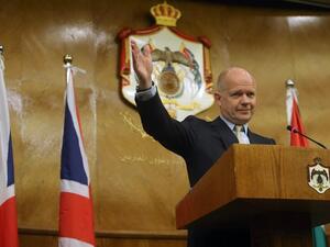 British Foreign Secretary William Hague waves during a press conference in Amman on May 22 (AFP)