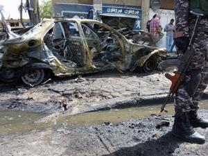 An Iraqi soldier stands on the scene of a car bombing on May 30 in the Iraqi capital, Baghdad. Iraq has seen a huge increase in violence over the past few months. AFP image